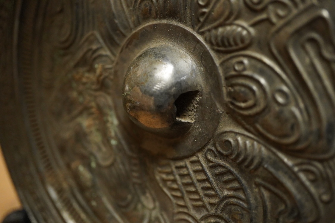 Chinese bronze ‘dragon’ mirror back, 19cm in diameter